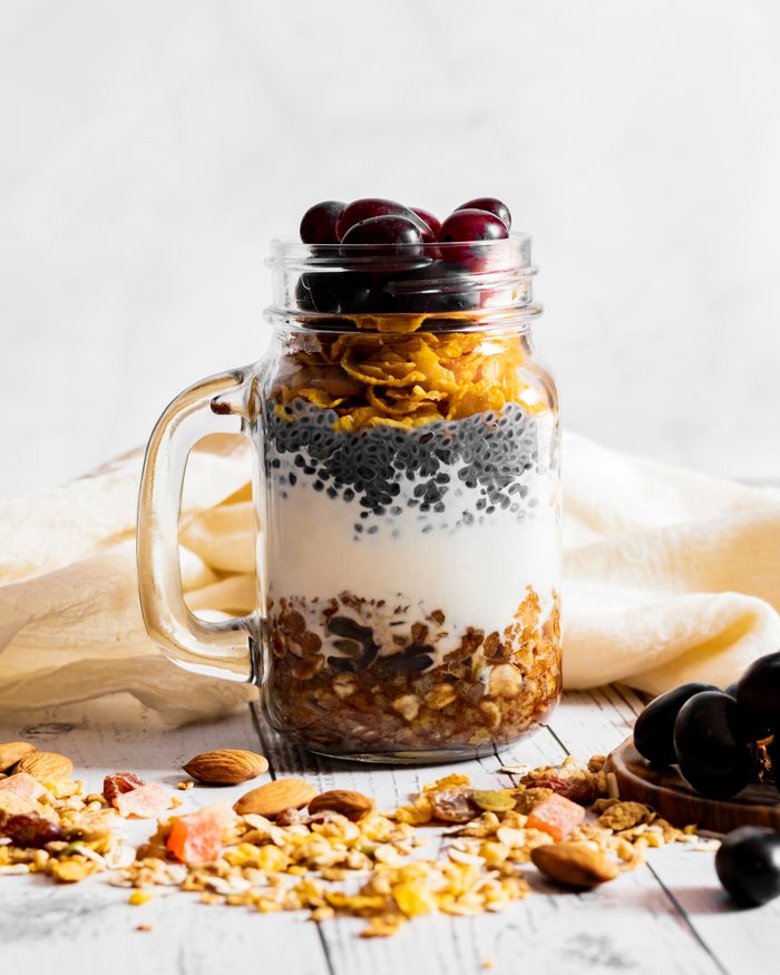 services-01 Savor a nutritious parfait featuring chia seeds, oats, and fresh fruit in a jar, perfect for a healthy breakfast.